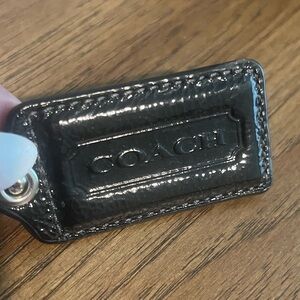 Coach black patent leather bag hangtag